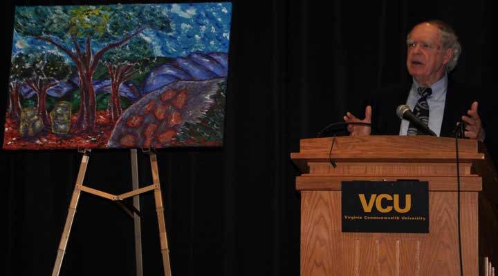 cliff edwards delivering a lecture from behind a podium next to a van gogh painting