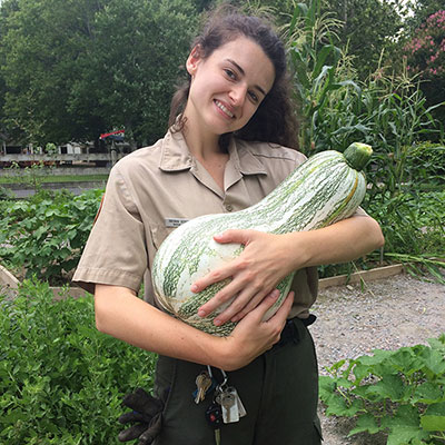 Brenna Geraghty holding a large squash